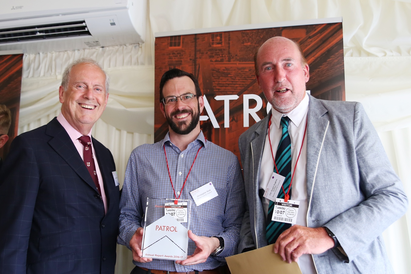 Photo of Councillor Stuart Hughes, Devon County Council; a representative from Brighton & Hove City Council and Gyles Brandreth at the Parking Annual Reports by Councils (PARC) Awards 2018